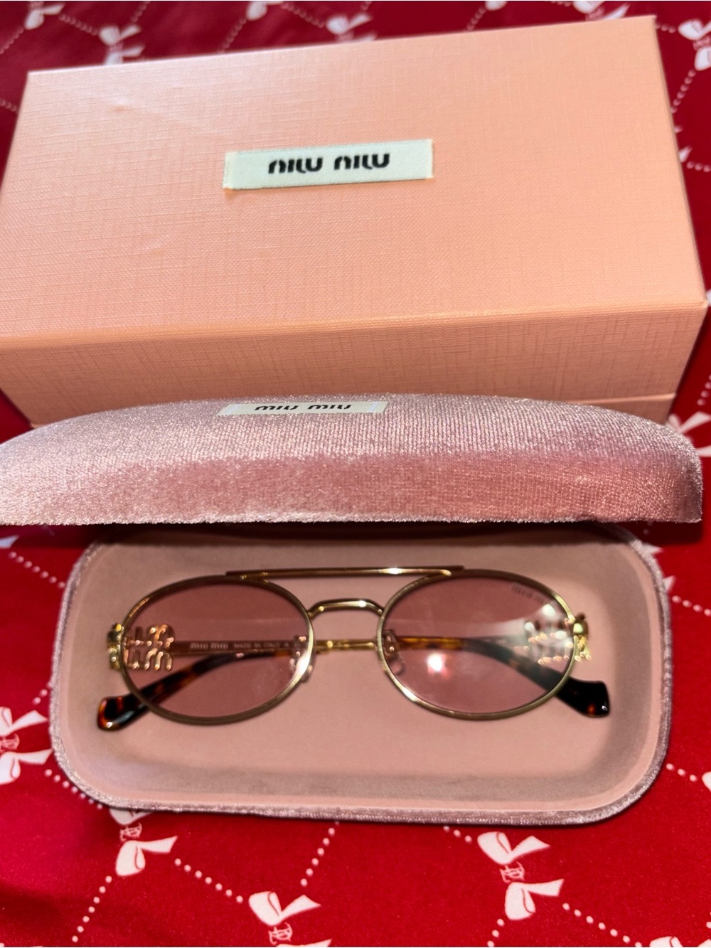 Miu Miu Gold Frame Sunglasses with Pink Lenses